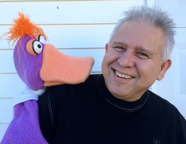 Gene Cordova with a puppet