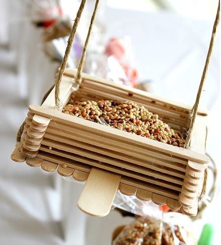 popsicle stick bird feeder with seeds