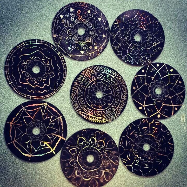 CDs with mandala scratch art