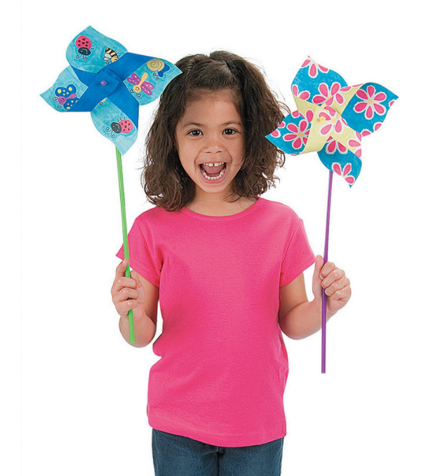 little girl holding colorful pinwheels