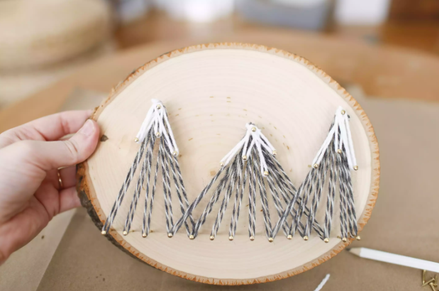 mountain string art on natural wood