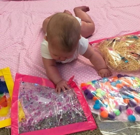 Baby with sensory bags