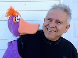 Gene Cordova with a puppet