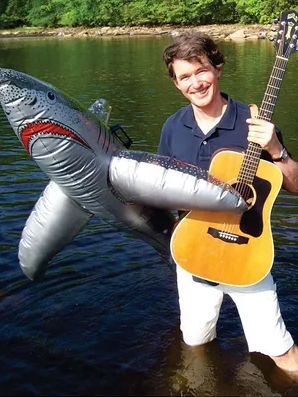 tom sieling with guitar and inflatable shark