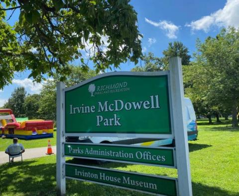 Irvine McDowell Park sign with the park in the background