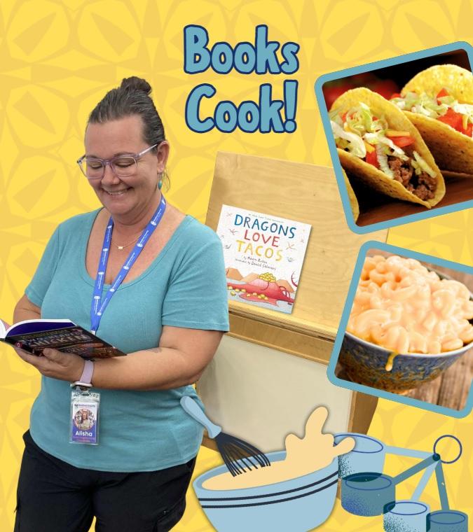 Alisha holding a book surrounded by food